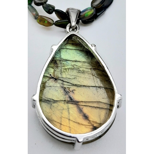 540 - A Labradorite Pendant on a Two-Row  Opal bead Necklace. Finished with a colour-play opal and diamond... 