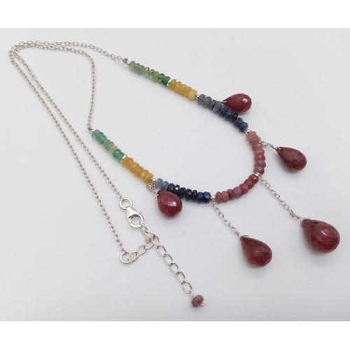 676 - A Ruby, Emerald and Sapphire Necklace with Hanging Ruby Drops set in 925 Silver. 20cm necklace lengt... 