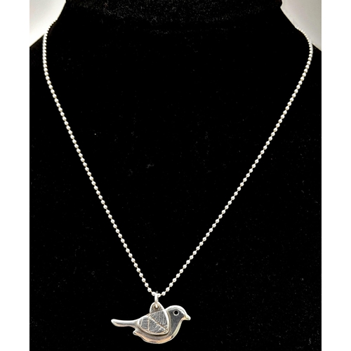 693 - A 0.999 Full Silver Bird Pendant on a 925 Silver Chain. Bird Length 23mm, Chain Length 19cm, Total w... 