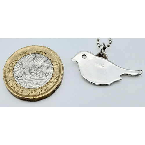 693 - A 0.999 Full Silver Bird Pendant on a 925 Silver Chain. Bird Length 23mm, Chain Length 19cm, Total w... 