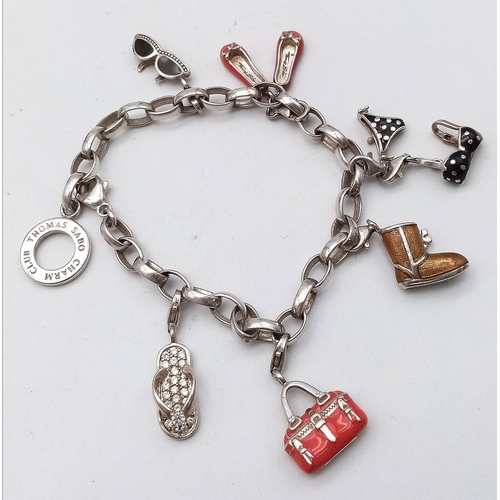 729 - Lovely Thomas Sabo 925 Silver Charm Bracelet.
Featuring a variety of fashion orientated, enamelled c... 