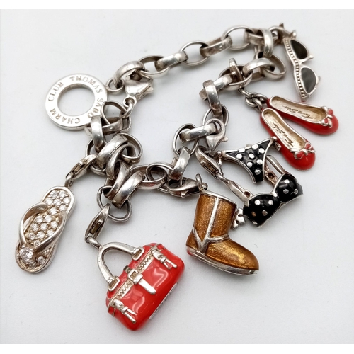 729 - Lovely Thomas Sabo 925 Silver Charm Bracelet.
Featuring a variety of fashion orientated, enamelled c... 