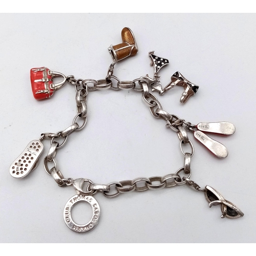 729 - Lovely Thomas Sabo 925 Silver Charm Bracelet.
Featuring a variety of fashion orientated, enamelled c... 