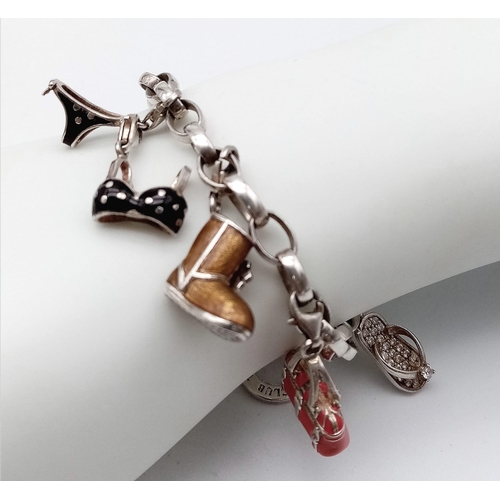 729 - Lovely Thomas Sabo 925 Silver Charm Bracelet.
Featuring a variety of fashion orientated, enamelled c... 