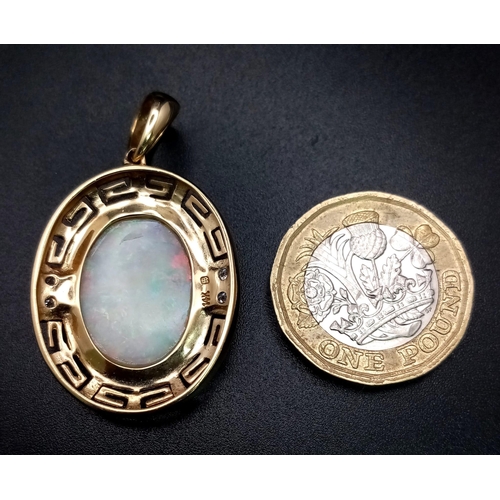 749 - A 14k Yellow Gold and Opal Pendant, featuring two small diamonds on each side, Opal dimensions: 20mm... 