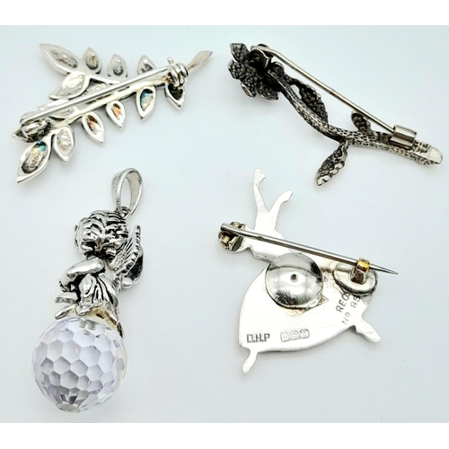 906 - Collection of four Sterling Silver Jewellery items.
Featuring one Cherub sat on a Crystal Ball Penda... 