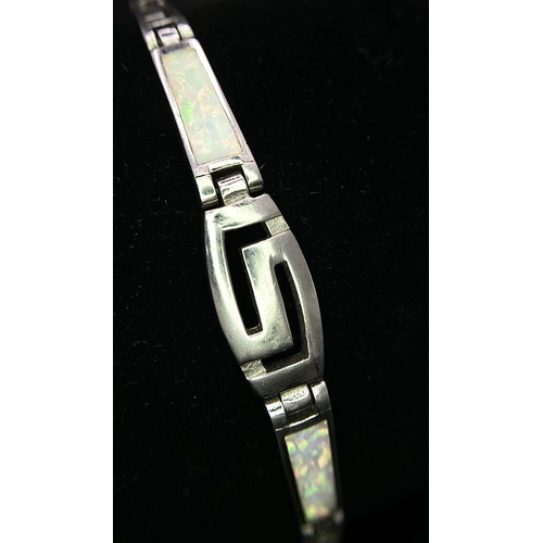 927 - Sterling Silver Greek Style Bracelet, set with Mother-Of-Pearl inlay. Measures 20cm in length. 
Weig... 