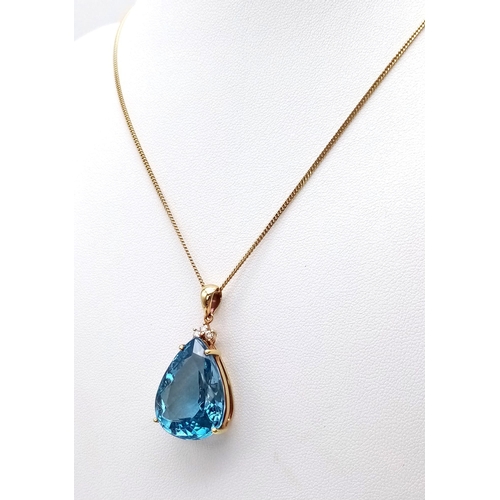 95 - A Captivating 29ct Brazilian Blue Topaz, Diamond and 18K Gold Pendant - On an 18K Yellow Gold Neckla... 