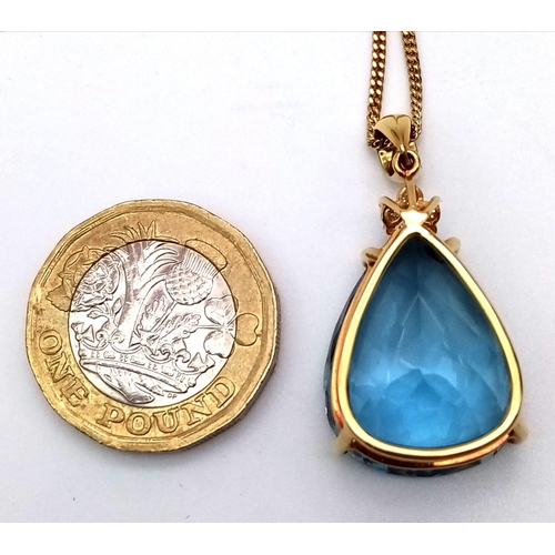 95 - A Captivating 29ct Brazilian Blue Topaz, Diamond and 18K Gold Pendant - On an 18K Yellow Gold Neckla... 