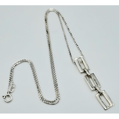 1023 - A STERLING SILVER NECKLACE AND SHAPES DROP PENDANT. TOTAL WEIGHT 7.3G. TOTAL LENGTH 46CM. 4097H