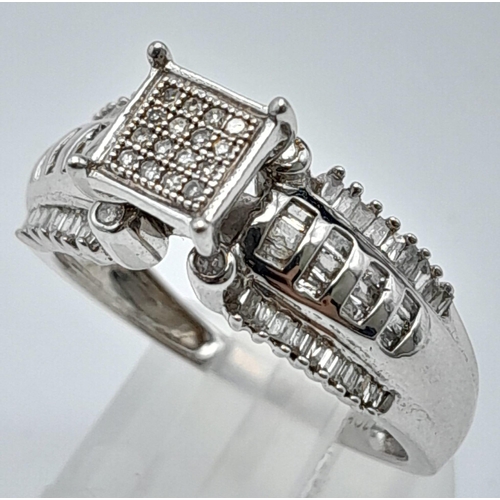 1386 - A 10K WHITE GOLD DIAMOND RING, WITH ROUND, BAGUETTE AND SQUARE CUT DIAMOND PAVE DECORATION 0.40CT 3.... 