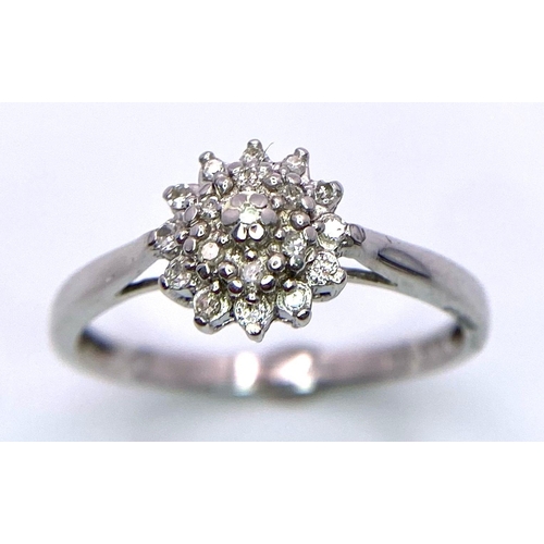 1267 - A 9K WHITE GOLD 0.10CT DIAMOND CLUSTER RING. TOTAL WEIGHT 2G. SIZE P