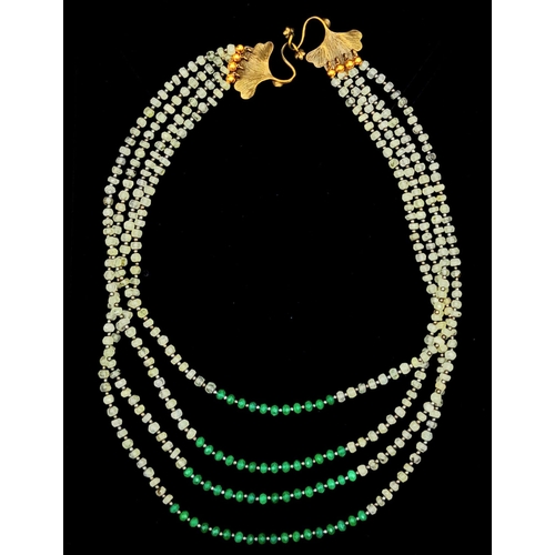 1199 - A very elegant, ART NOUVEAU, four row necklace with natural faceted peridot and emerald rondelles, i... 