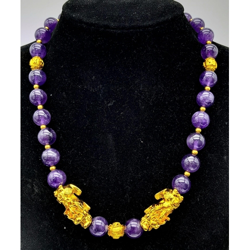 1206 - A sophisticated, amethyst necklace with gold filled Chinese “pixiu” protective dogs (sometimes calle... 