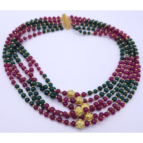 1238 - An impressive, six strand necklace with rubies and emeralds in a geometric design and accompanied by... 