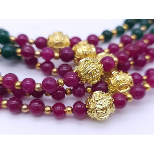 1238 - An impressive, six strand necklace with rubies and emeralds in a geometric design and accompanied by... 