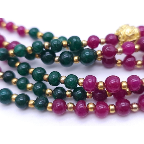 1238 - An impressive, six strand necklace with rubies and emeralds in a geometric design and accompanied by... 