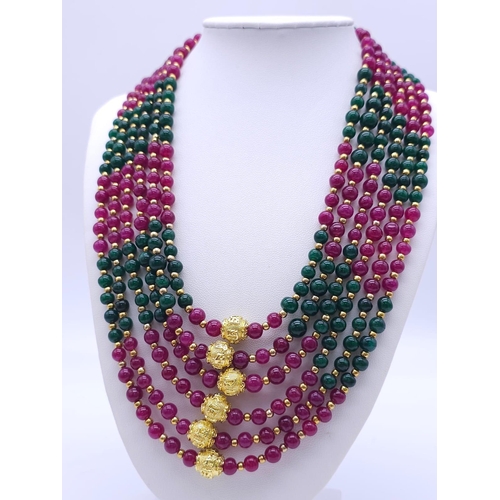 1238 - An impressive, six strand necklace with rubies and emeralds in a geometric design and accompanied by... 