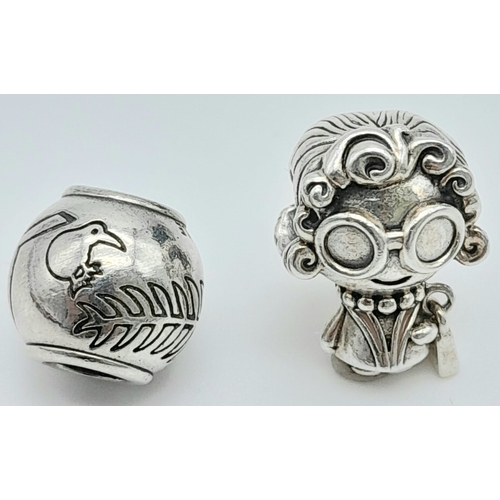 1354 - 2 X PANDORA CHARMS - GIRL CHARM HOLDING PANDORA BAG & FEATHER BALL CHARM. Total weight: 9.4G 
ref: S... 