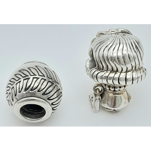 1354 - 2 X PANDORA CHARMS - GIRL CHARM HOLDING PANDORA BAG & FEATHER BALL CHARM. Total weight: 9.4G 
ref: S... 