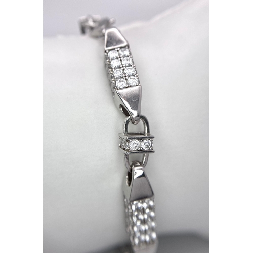 1414 - A FANCY STERLING SILVER STONE SET LINK BRACELET. TTOAL WEIGHT 33.4G. TOTAL LENGTH 21CM.