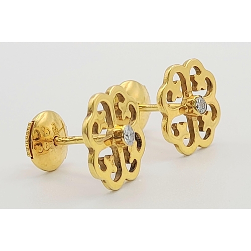 1421 - A matching set of 18k yellow gold 0.09CT Diamond pair of earrings and ring in floral design. Ring's ... 