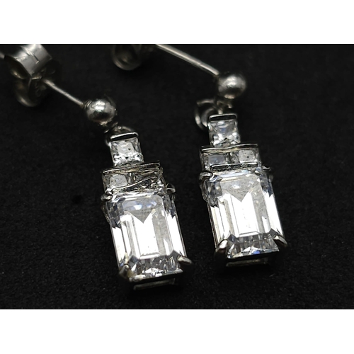 1308 - A 9k white gold CZ drop pair of earrings. 3.1g total weight.