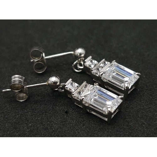 1308 - A 9k white gold CZ drop pair of earrings. 3.1g total weight.