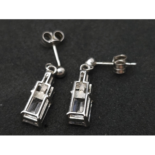 1308 - A 9k white gold CZ drop pair of earrings. 3.1g total weight.