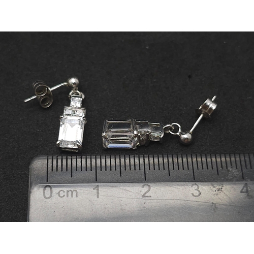 1308 - A 9k white gold CZ drop pair of earrings. 3.1g total weight.