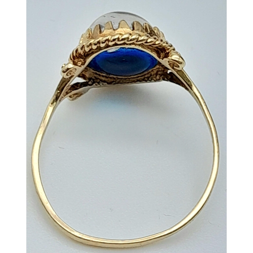 1663 - A 9K YELLOW GOLD BLUE STONE SET RING 1.7G SIZE N