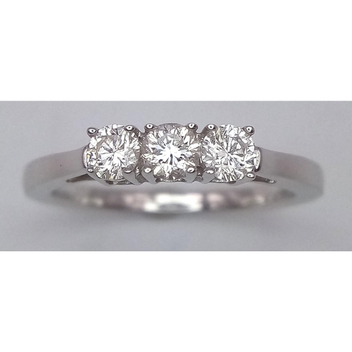 159 - A 18CT WHITE GOLD DIAMOND 3 STONE RING 0.30CT 3.4G SIZE M 1/2
ref: P154