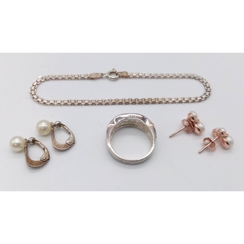 1620 - A varied collection of Sterling Silver Jewellery.
Featuring two pairs of Pearl earrings, one pink to... 