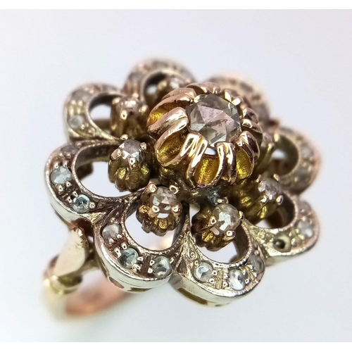 17 - An antique, 14 K yellow gold ring with a fancy cluster of old cut diamonds, ring size: K1/2, weight;... 