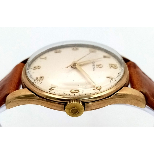 173 - A 9K YELLOW GOLD CASED OMEGA WATCH ON TAN LEATHER STRAP. FULL WORKING ORDER 
ref: MB 5001