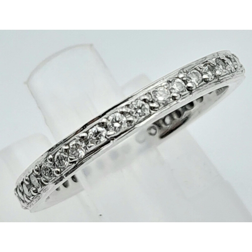 201 - PLATINUM DIAMOND SET FULL ETERNITY RING, 0.60CT.
WEIGHT: 3.4G 
SIZE: J 1/2 

SC 5001