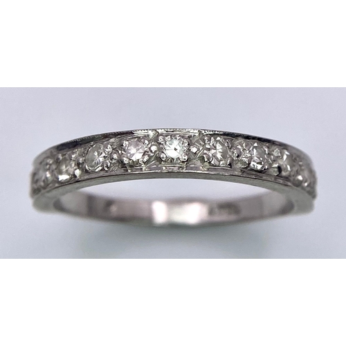 268 - An 18 k white gold half eternity diamond (0.30 carats) ring. Size: N, weight: 3.3 g.