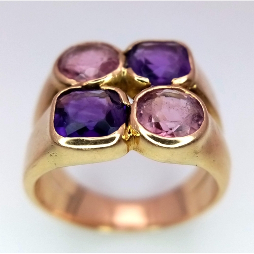 31 - A 14 K rose gold ring with four amethysts. ring size; P, weight: 10 g.