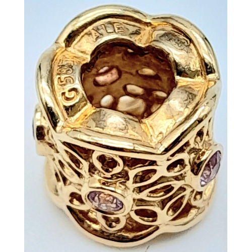 350 - A 14 K yellow gold PANDORA bead with a flower motif adorned with round cut amethysts. weight: 2.9 g.