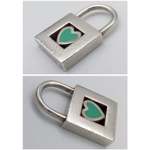 422 - A rare, vintage, sterling silver TIFFANY & CO blue heart padlock  charm. Weight; 6.2 g.