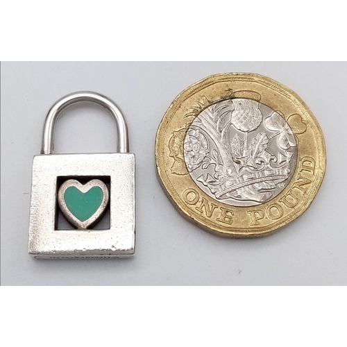 422 - A rare, vintage, sterling silver TIFFANY & CO blue heart padlock  charm. Weight; 6.2 g.