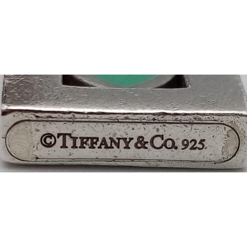 422 - A rare, vintage, sterling silver TIFFANY & CO blue heart padlock  charm. Weight; 6.2 g.