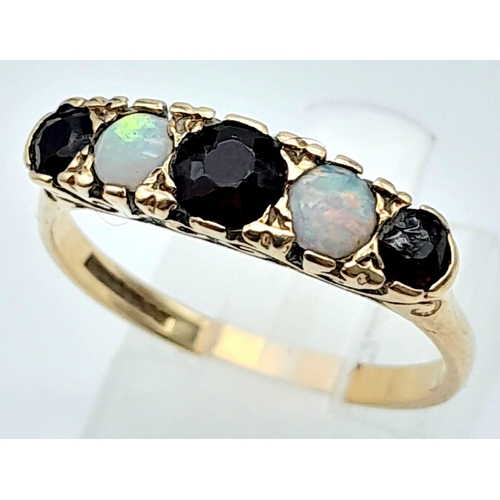 517 - 9K YELLOW GOLD VINTAGE GARNET AND OPAL 5 STONE RING 
WEIGHT: 2.4G 
SIZE P

SC 5010