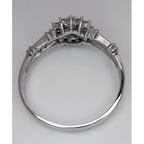 581 - 9K White gold Diamond Set Cluster Ring with Diamond Shoulders.  2.6g.  Size T1/2. (dia 0.50ct). Ref:... 