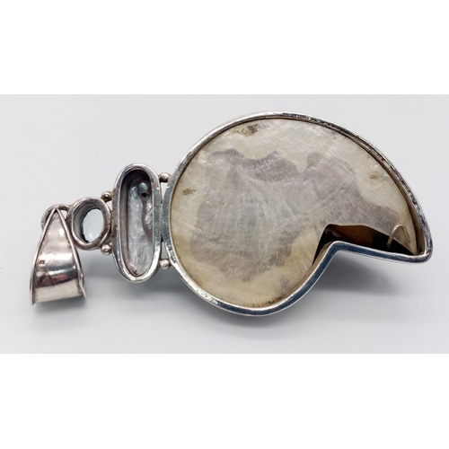 665 - A Sterling Silver Shell Shaped Fancy Stone Set Pendant. Approximately 10cm length (including bail), ... 