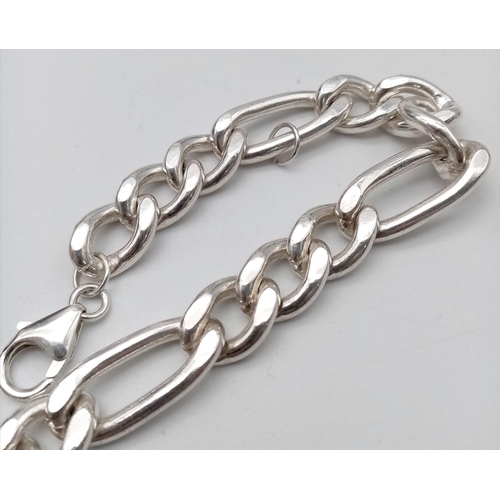 672 - A Sterling Silver Figaro Bracelet. Approximately 18.4cm length, 37.4g total weight.