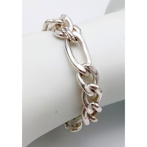 672 - A Sterling Silver Figaro Bracelet. Approximately 18.4cm length, 37.4g total weight.