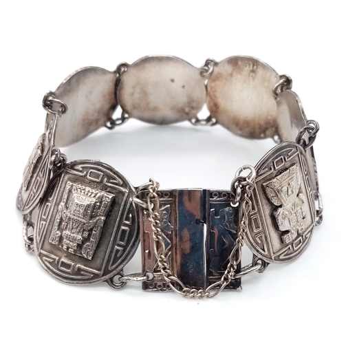 755 - A SILVER AZTEC STYLE BRACELET 26.1G 18.5cm
ref: SC 5063