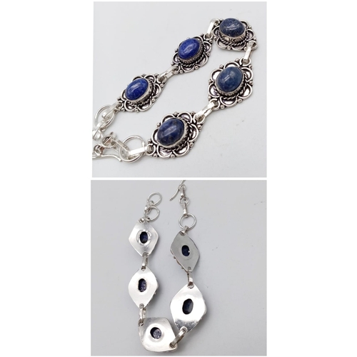 765 - A Lapis Lazuli Jewellery Suite. To include: Egyptian style choker necklace - 38cm. Decorative oval b... 