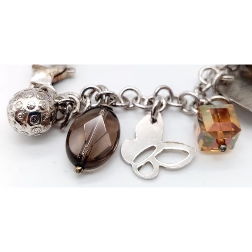 857 - Sterling Silver Multi Charm Bracelet with Smokey Quartz 23.5g. 20cm length.  Ref: SH3424H